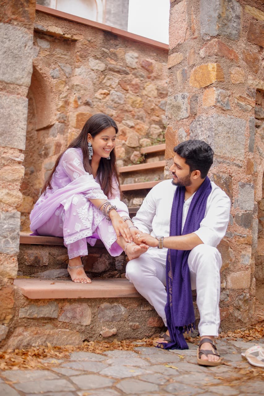 Couple during a romantic rainy pre-wedding shoot in Old Delhi.